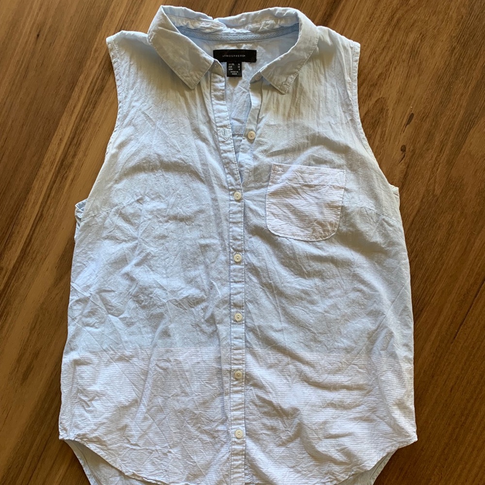 Light blue sleeveless button up